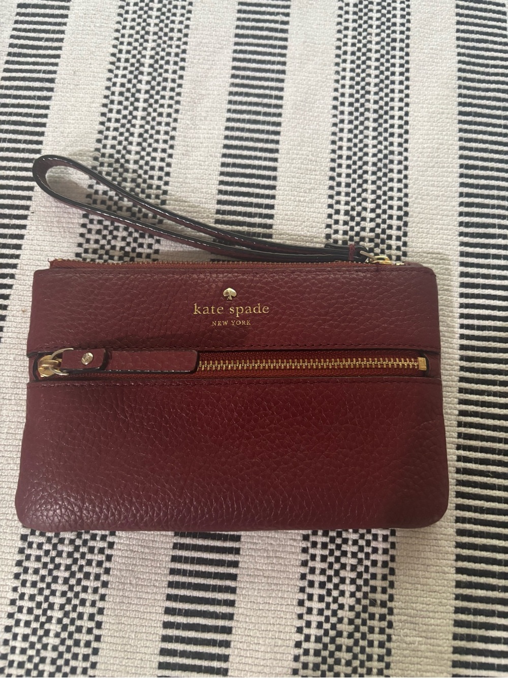 kate spade Burgundy Pebbled Leather Wristlet with Gold Hardware